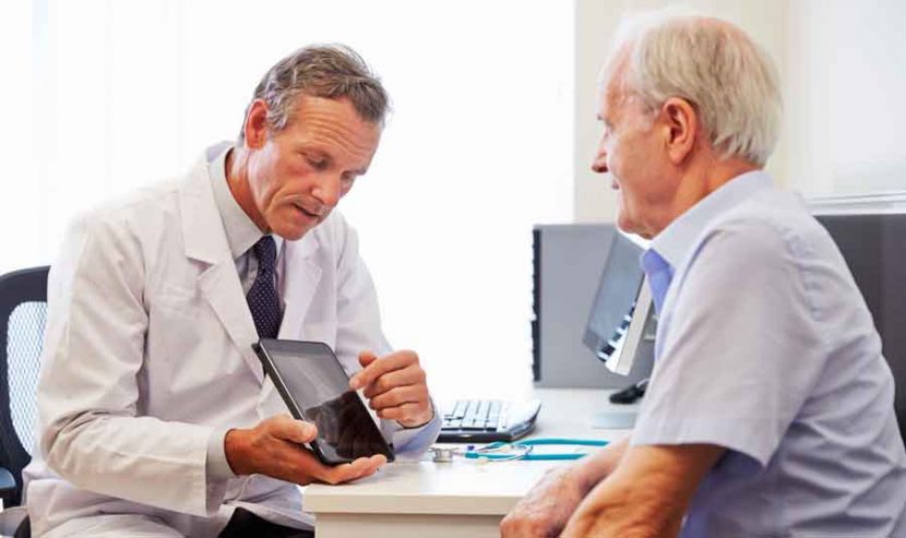 Medical consultant discusses results with patient