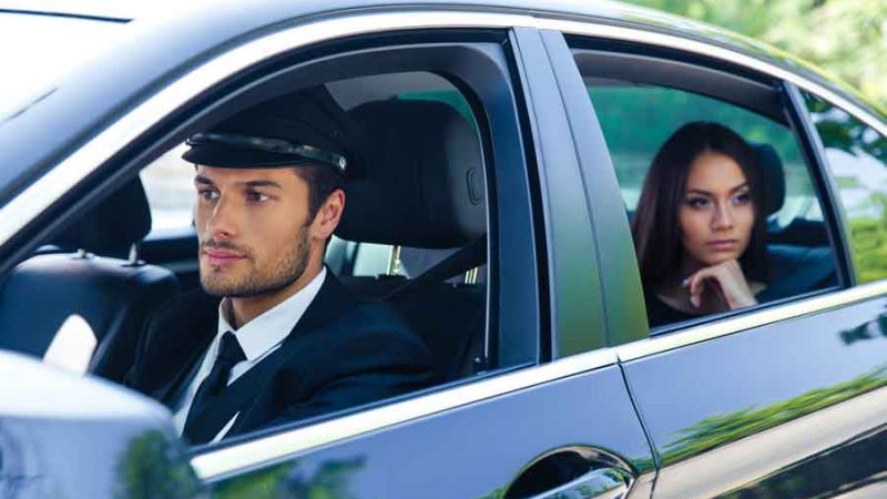 Woman being driven in a car